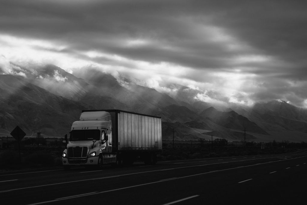 white trailer truck on road